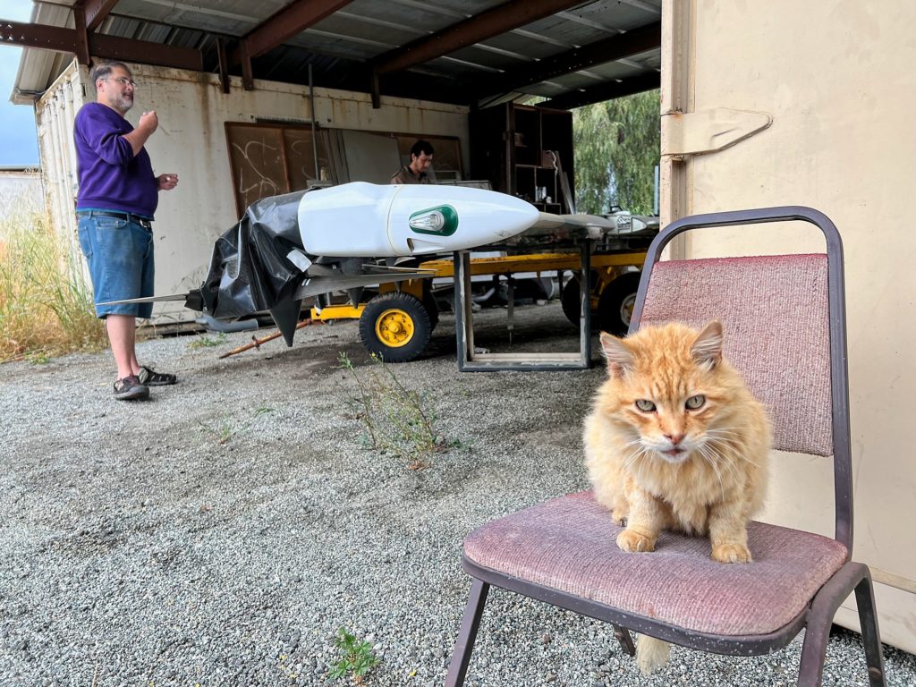 Fritz looks on as Chris and Charles prepare to move the wings