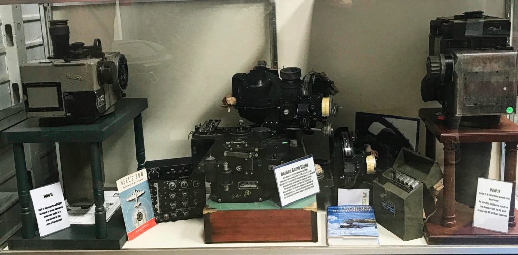 Bomb sight cabinet - from left: Rare German-BDZ-2 BS, USA-Norden BS, Rare German Lofte 7D