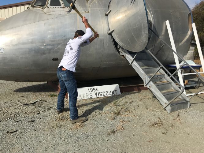 Digging a post hole for the new sign